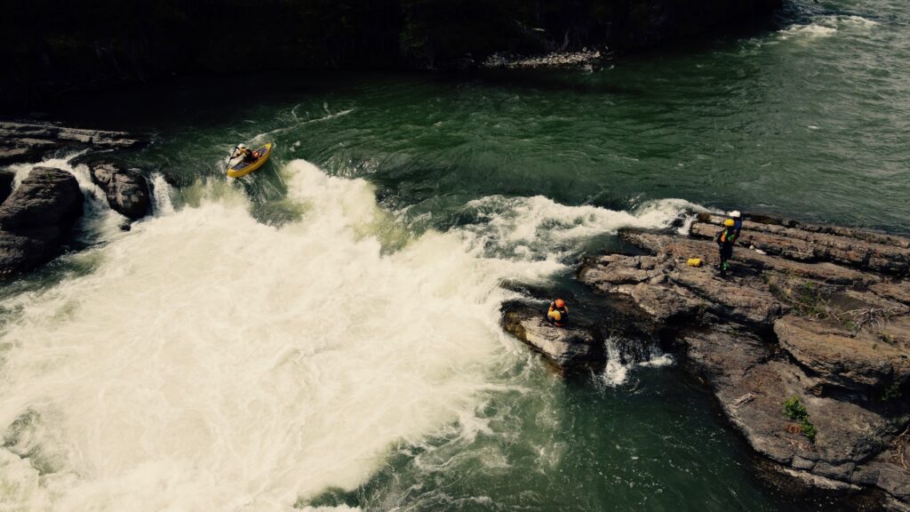 Canoe over rapid